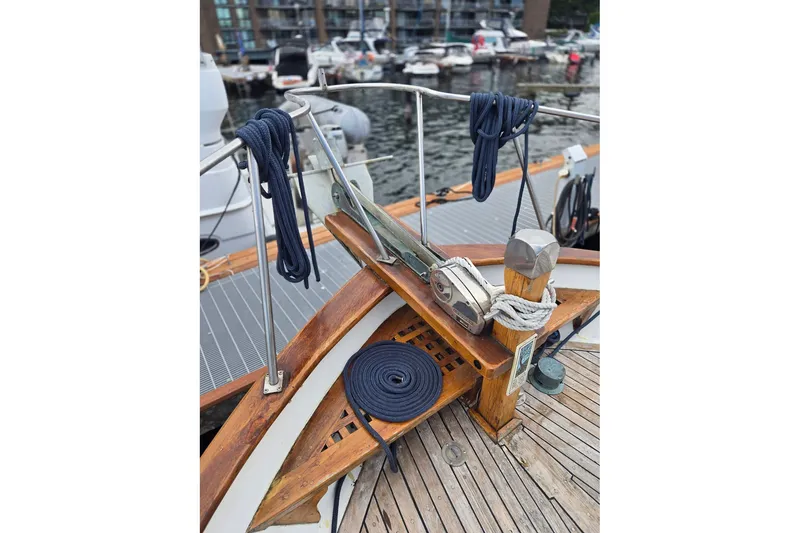 Slide: The Image of 1979 Ocean Alexander 40 Double Cabin deck with ropes and winch, docked at marina. - 6