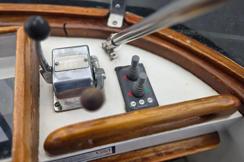 Slide: The Image of Control panel of a 1979 Ocean Alexander 40 Double Cabin boat with marine engine controls. - 64