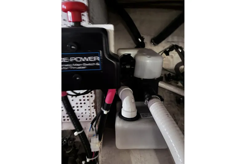 Slide: The Image of Engine compartment of a 1979 Ocean Alexander 40 Double Cabin with mechanical components. - 51