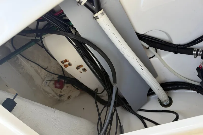 Slide: The Image of Interior wiring and components of a 2000 Boston Whaler 21 Outrage boat. - 16