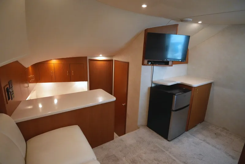 Slide: The Image of Interior of the 1999 Ocean Yachts 40 Super Sport with cozy seating and modern amenities. - 19