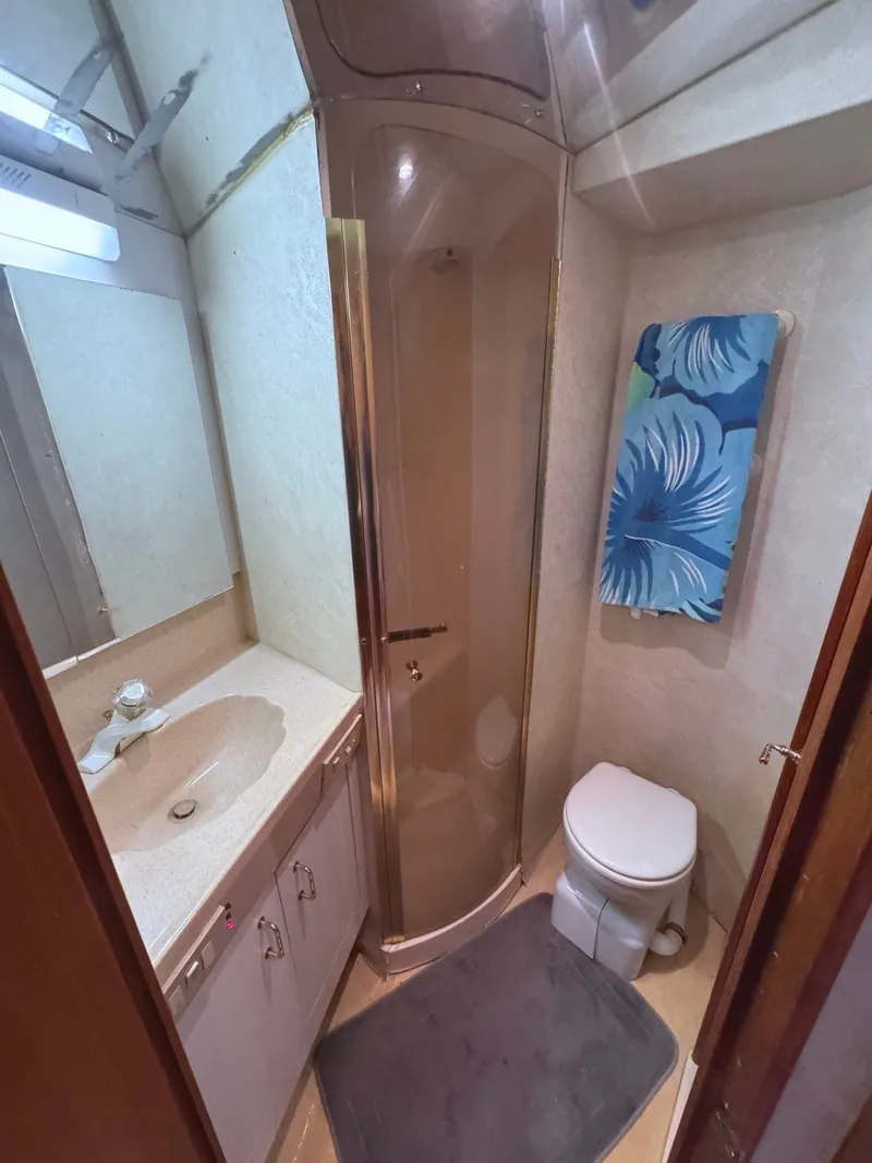 Slide: The Image of Bathroom with shower, toilet, and sink inside a yacht. - 27