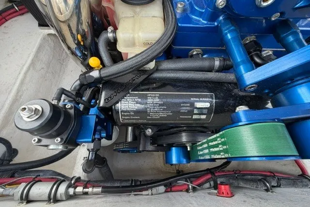 Slide: The Image of Engine compartment of a 2008 Donzi 27 ZR boat, showcasing mechanical components and wiring. - 17