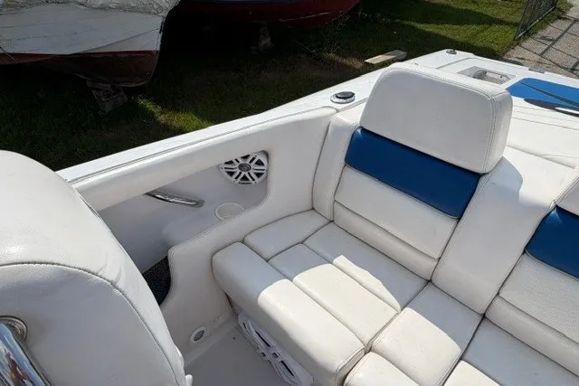 Slide: The Image of 2008 Donzi 27 ZR boat interior with white and blue seating, showcasing luxury design. - 9
