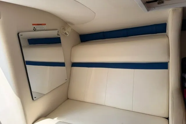 Slide: The Image of Interior of 2008 Donzi 27 ZR boat with white and blue seating. - 15