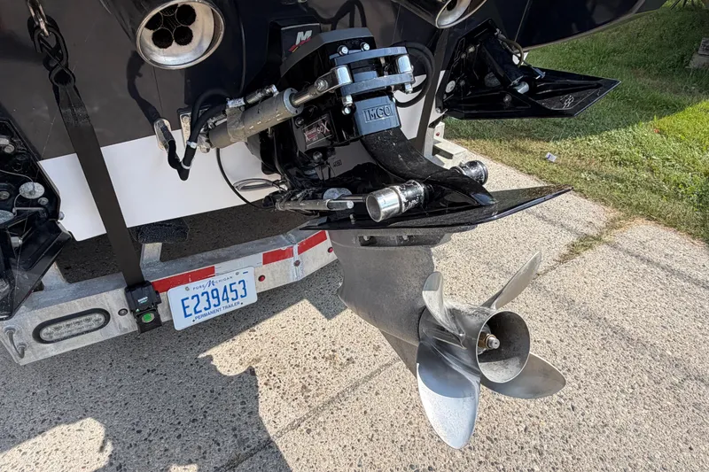 Slide: The Image of Rear view of a 2008 Donzi 27 ZR boat showing propeller and trailer. - 15