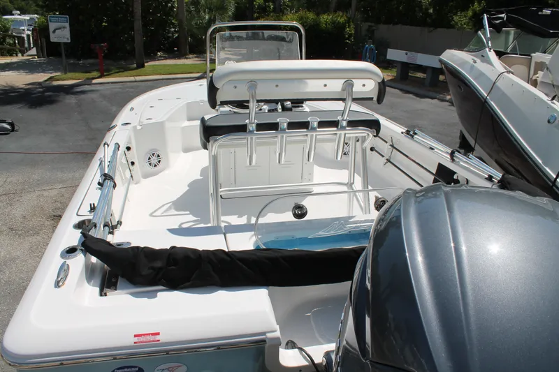 Slide: The Image of 2026 Tidewater 1910 Bay Max boat with sleek interior and powerful engine, parked outdoors. - 8