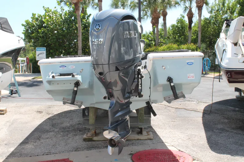 Slide: The Image of 2026 Tidewater 1910 Bay Max boat with Yamaha 150 outboard motor displayed outdoors. - 4