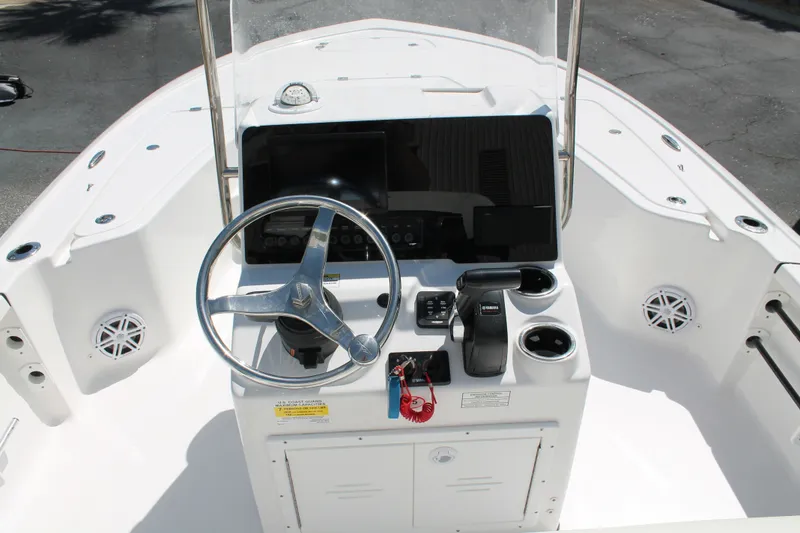 Slide: The Image of 2026 Tidewater 1910 Bay Max boat console with steering wheel and controls. - 9
