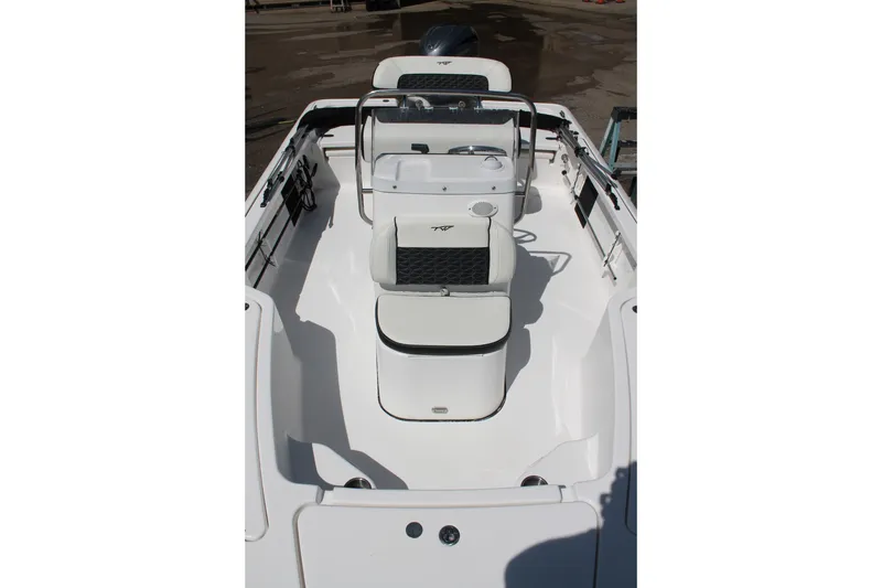 Slide: The Image of 2026 Tidewater 1910 Bay Max boat interior with seating and steering console. - 13