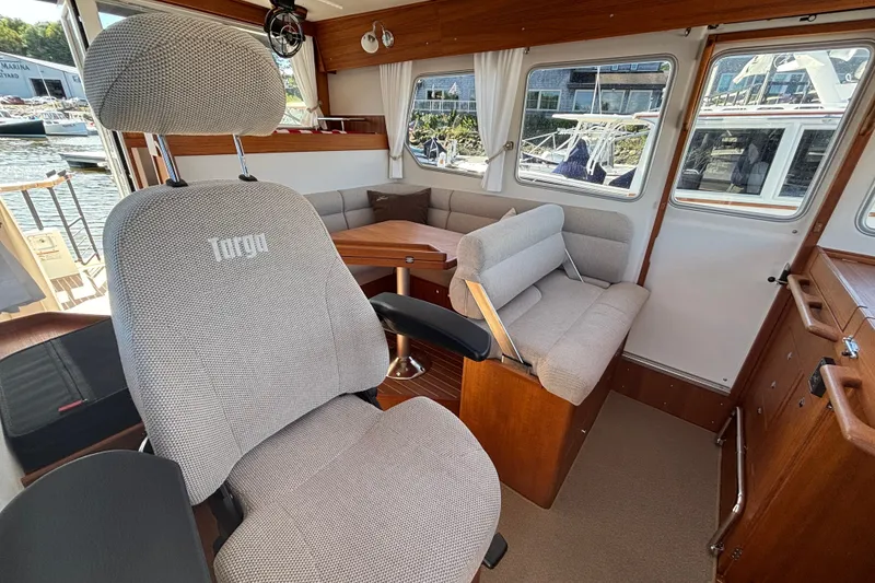 Slide: The Image of Interior of 2024 Targa 32 boat with seating and wooden accents. - 28