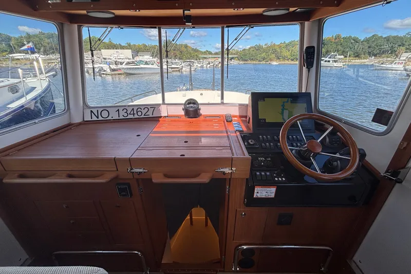 Slide: The Image of 2024 Targa 32 boat cockpit with wooden dashboard and navigation equipment. - 35
