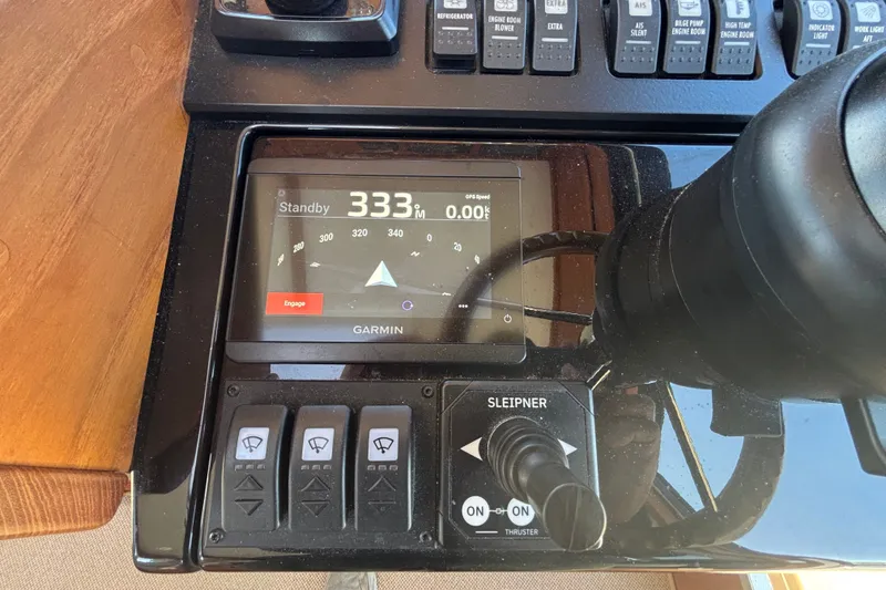 Slide: The Image of Control panel of 2024 Targa 32 boat with Garmin navigation display. - 42