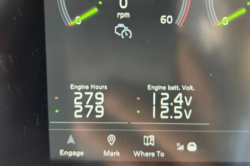 Slide: The Image of Dashboard display of a 2024 Targa 32 showing engine hours and battery voltage. - 65