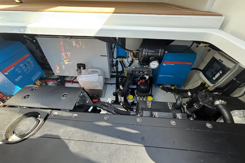 Slide: The Image of Engine compartment of 2024 Targa 32 boat, showcasing electrical systems and components. - 63