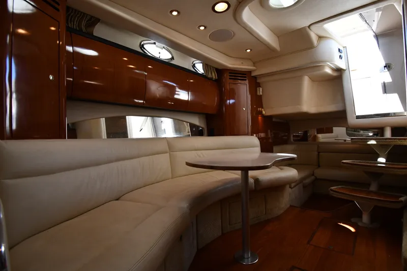 Slide: The Image of Luxurious interior of 2002 Sea Ray 360 Sundancer yacht with plush seating and elegant wood finishes. - 28