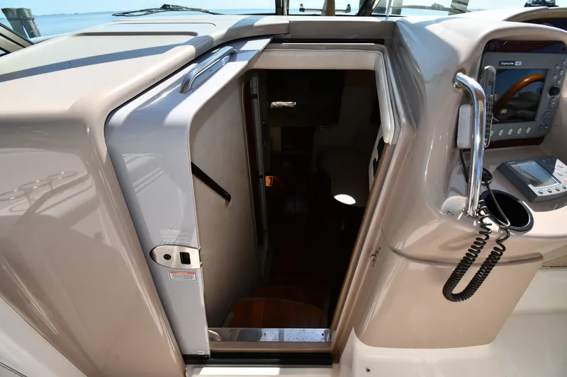 Slide: The Image of 2002 Sea Ray 360 Sundancer cabin entrance with control panel and marine radio. - 20