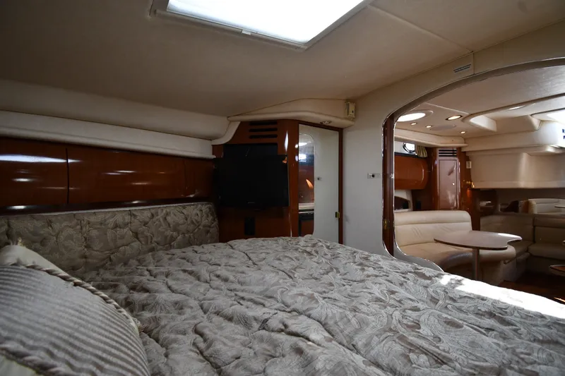 Slide: The Image of Interior of 2002 Sea Ray 360 Sundancer yacht with cozy bedroom and elegant seating area. - 24