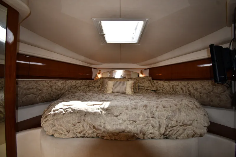 Slide: The Image of Luxurious cabin interior of 2002 Sea Ray 360 Sundancer yacht with plush bedding. - 22