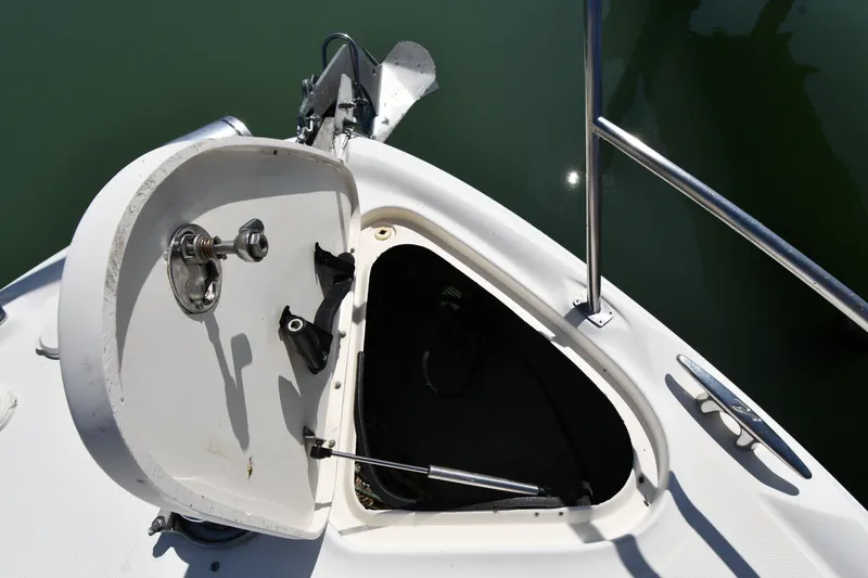 Slide: The Image of Open anchor locker on a 2002 Sea Ray 360 Sundancer boat, showing storage compartment. - 5