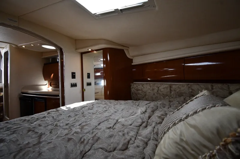 Slide: The Image of Luxurious interior cabin of 2002 Sea Ray 360 Sundancer yacht with elegant bedding. - 23