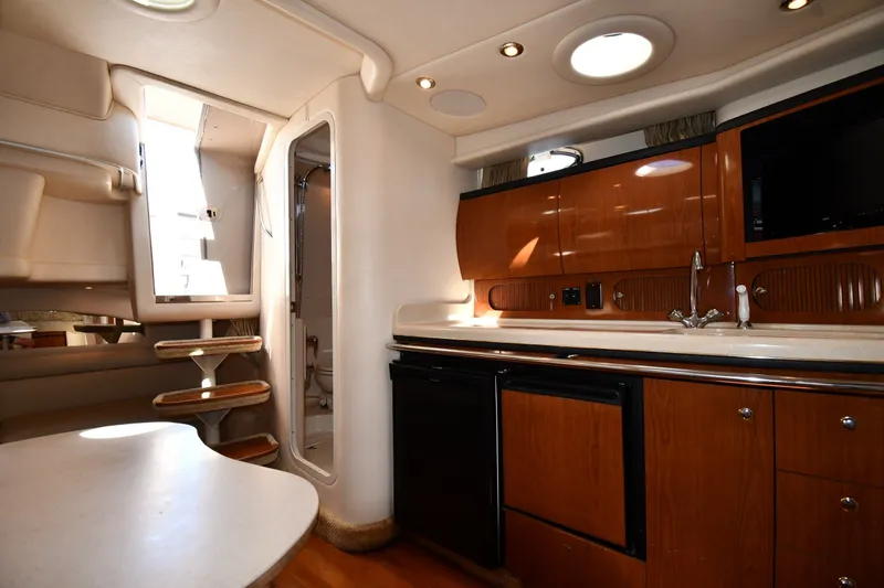Slide: The Image of Interior of 2002 Sea Ray 360 Sundancer yacht with kitchenette and stairs. - 27