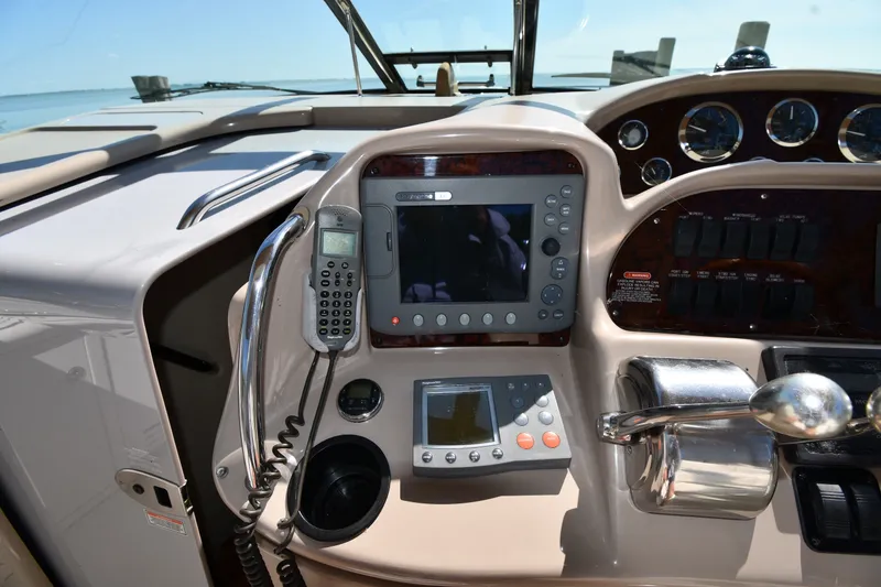 Slide: The Image of Control panel of a 2002 Sea Ray 360 Sundancer boat with navigation equipment. - 11