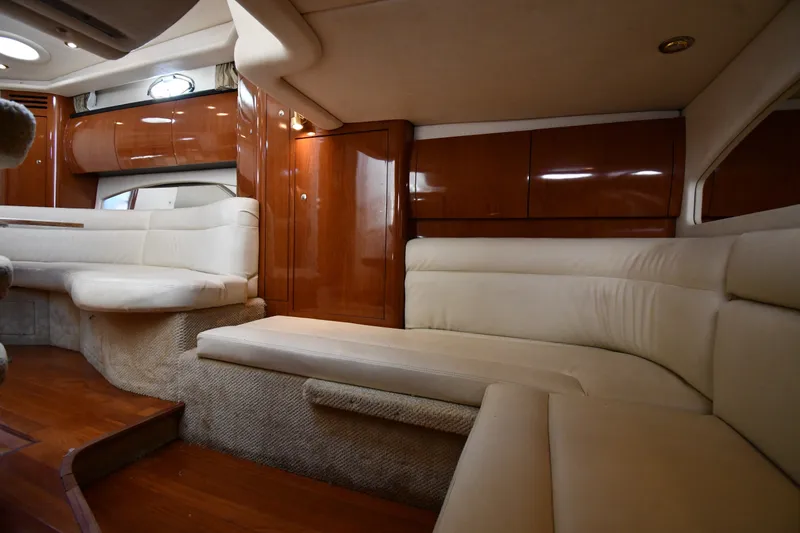 Slide: The Image of Luxurious interior of 2002 Sea Ray 360 Sundancer yacht with plush seating and wood finishes. - 35
