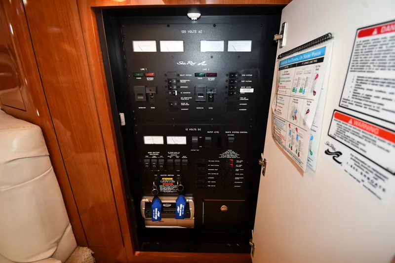 Slide: The Image of Electrical control panel inside a 2002 Sea Ray 360 Sundancer yacht. - 38