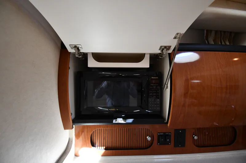 Slide: The Image of Microwave in 2002 Sea Ray 360 Sundancer yacht's wooden interior kitchen cabinet. - 31