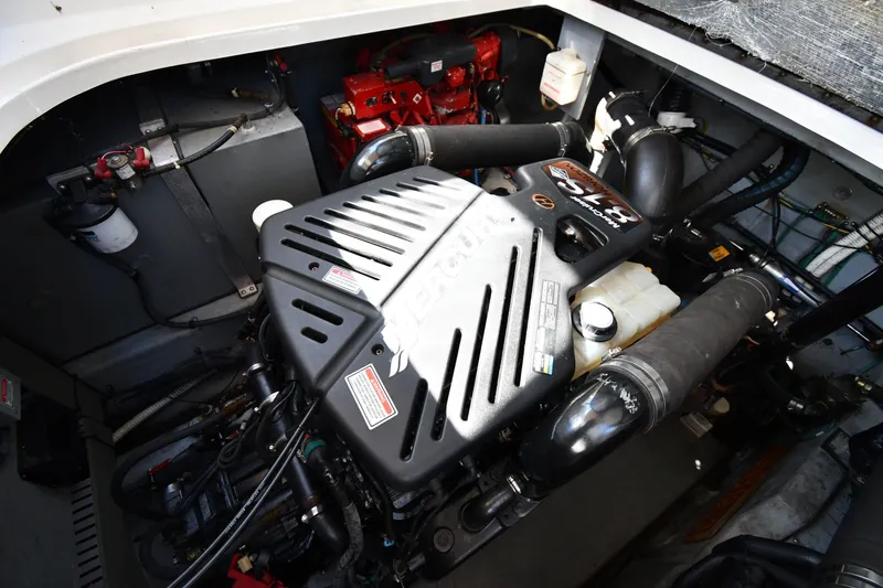Slide: The Image of Engine compartment of a 2002 Sea Ray 360 Sundancer boat, showcasing mechanical components. - 42