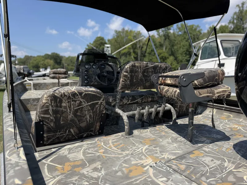 Slide: The Image of The image shows the cockpit of a War Eagle 2170 Blackhawk boat with camo-patterned seats. - 5