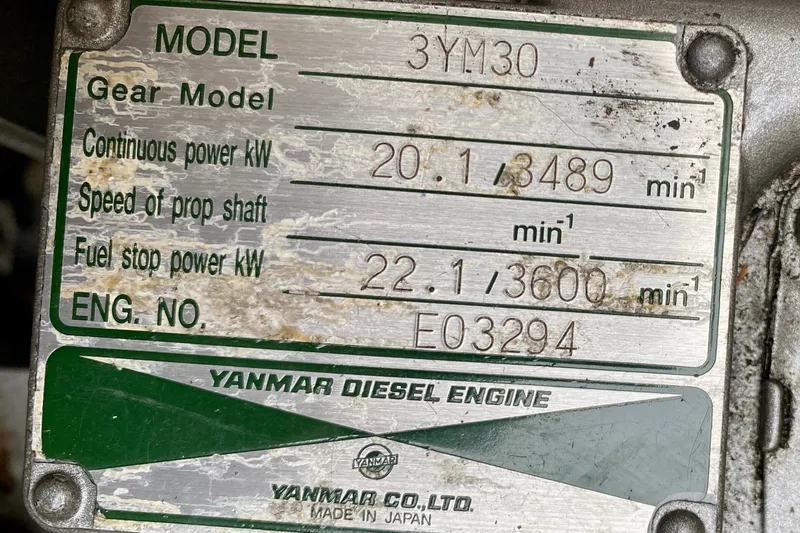 Slide: The Image of Yanmar diesel engine plate on Lagoon 380 S2, 2005 model, showing specifications and engine number. - 107