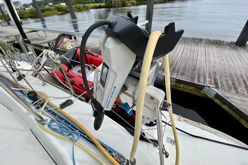 Slide: The Image of Lagoon 380 S2 sailboat with Spirit 1.0 Plus motor docked by the water. - 151