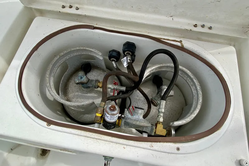 Slide: The Image of Propane tank compartment on a 2005 Lagoon 380 S2 catamaran. - 148