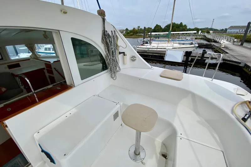 Slide: The Image of Lagoon 380 S2 catamaran cockpit area, 2005 model, docked at marina. - 35