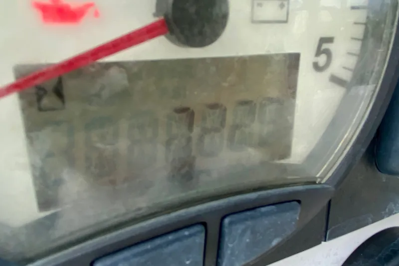 Slide: The Image of Close-up of a Lagoon 380 S2 2005 speedometer displaying 3887 hours. - 144