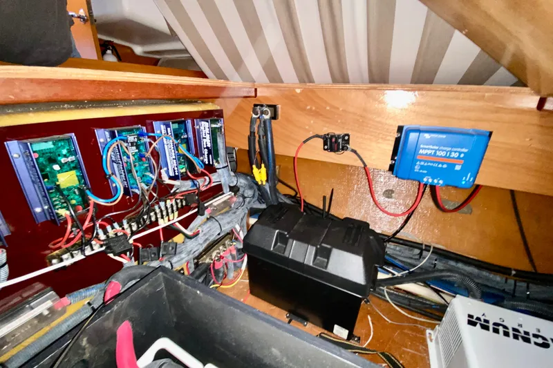 Slide: The Image of Electrical system inside a 2005 Lagoon 380 S2 yacht, featuring wiring and components. - 120