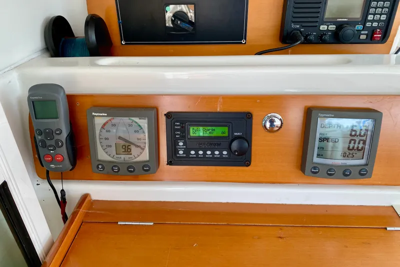 Slide: The Image of Control panel of a 2005 Lagoon 380 S2 catamaran with navigation instruments. - 85