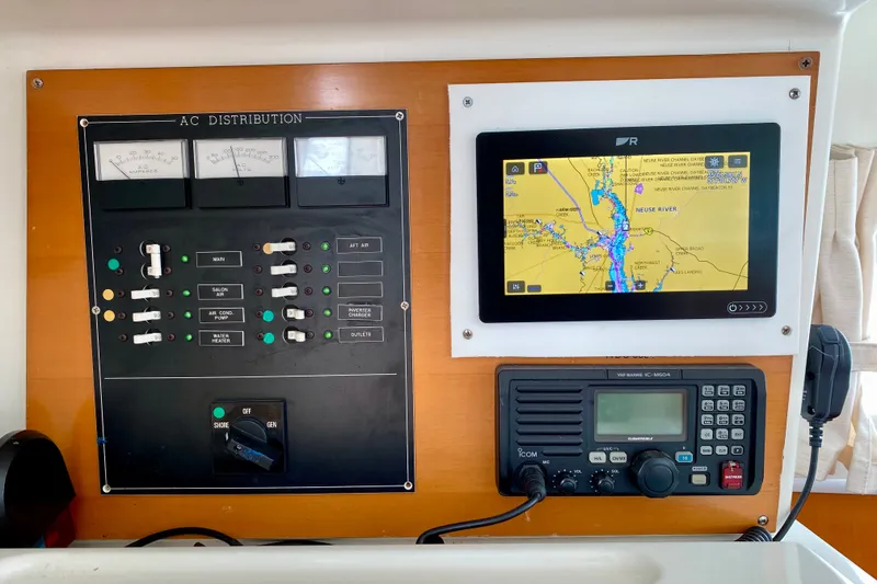 Slide: The Image of Control panel of a 2005 Lagoon 380 S2 yacht with navigation and communication systems. - 84