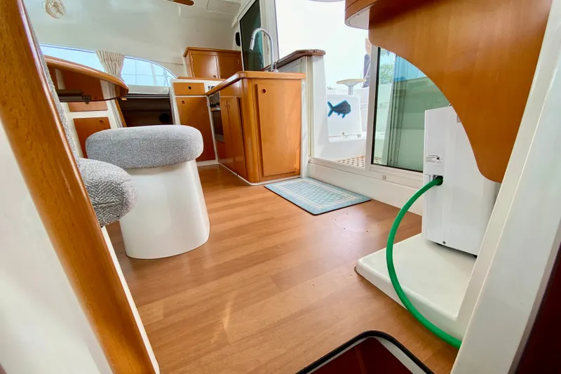 Slide: The Image of Interior of 2005 Lagoon 380 S2 catamaran with wooden flooring and modern furnishings. - 94