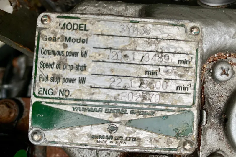 Slide: The Image of Yanmar diesel engine plate on 2005 Lagoon 380 S2, showing power specifications and model details. - 101