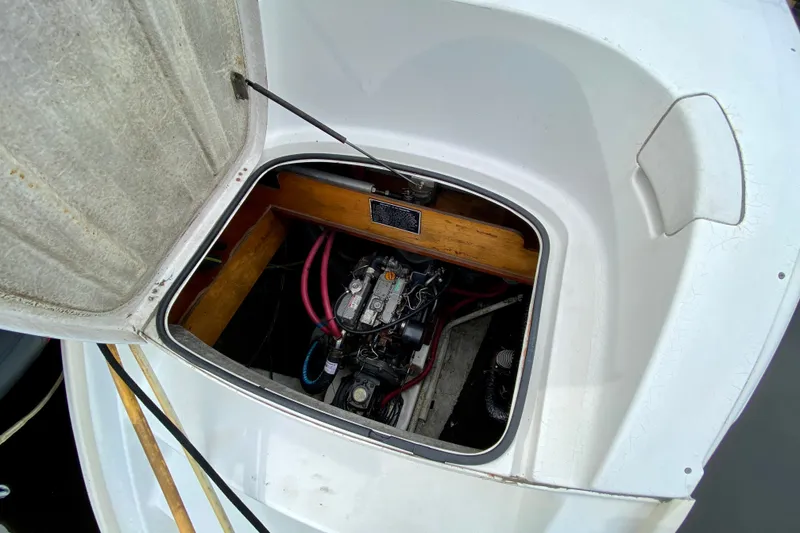 Slide: The Image of Engine compartment of a 2005 Lagoon 380 S2 catamaran, showcasing mechanical components. - 96