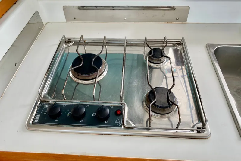 Slide: The Image of Stainless steel stove on 2005 Lagoon 380 S2 yacht kitchen counter. - 123