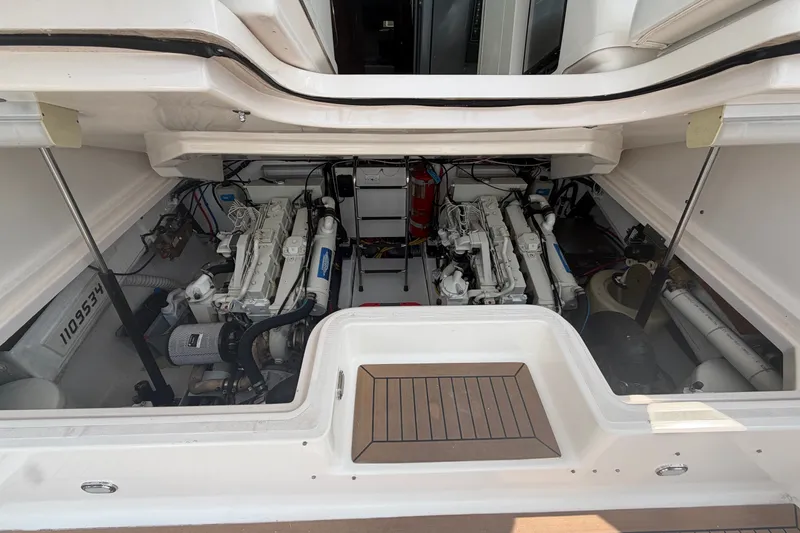Slide: The Image of Engine compartment of a 2001 Tiara Yachts 3800 Open, showcasing dual engines and equipment. - 10
