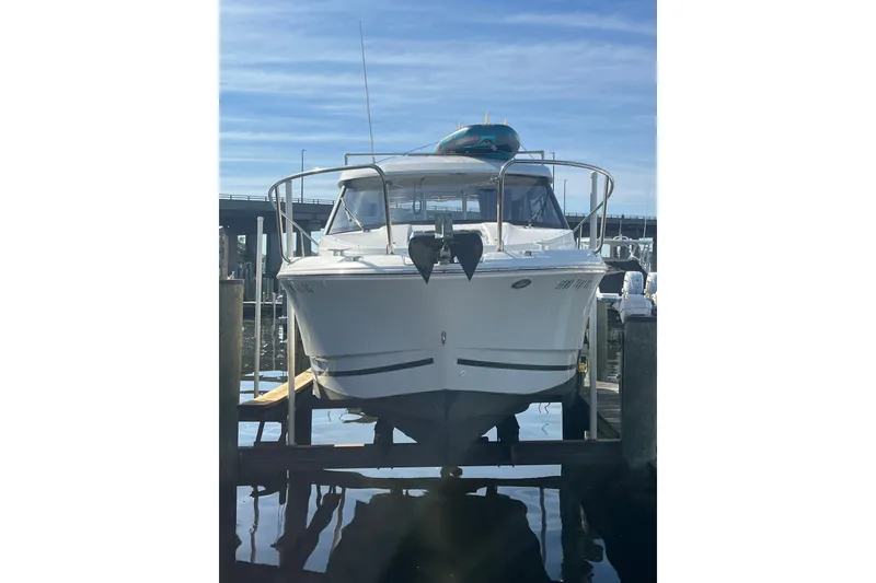 Slide: The Image of 2020 Jeanneau NC 795 boat docked at marina under clear blue sky. - 4