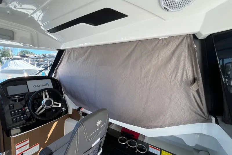 Slide: The Image of Interior of 2020 Jeanneau NC 795 boat with Garmin navigation system and covered window. - 35