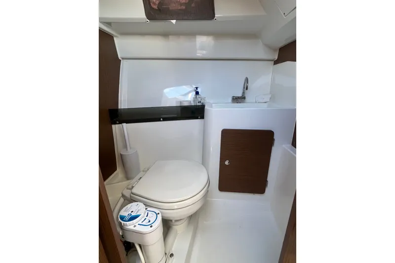 Slide: The Image of Compact bathroom in 2020 Jeanneau NC 795 boat with toilet and sink. - 27