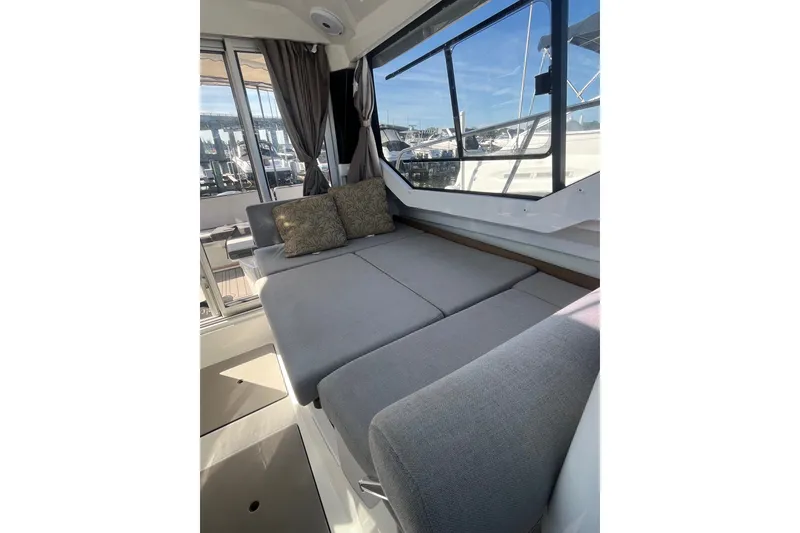 Slide: The Image of Interior view of 2020 Jeanneau NC 795 boat with comfortable seating and cushions. - 32