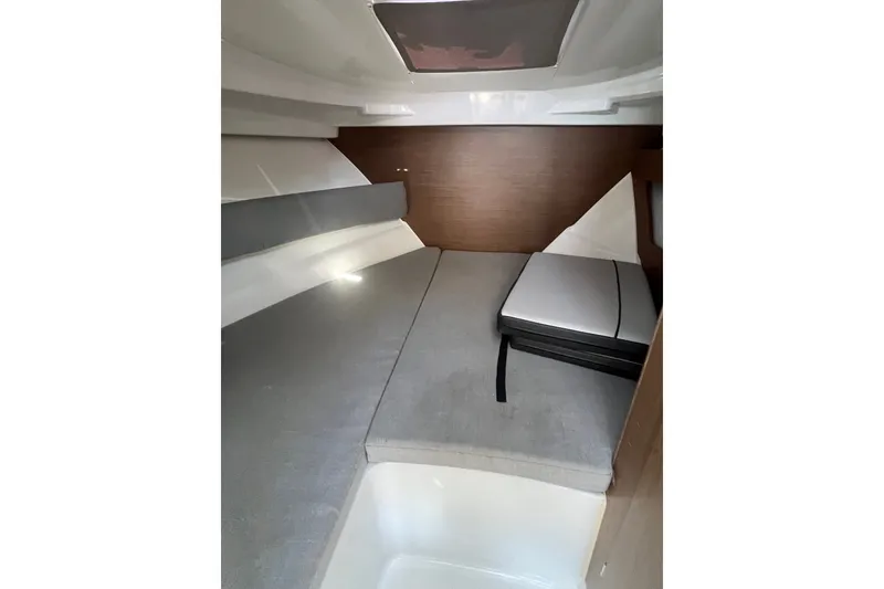 Slide: The Image of Interior cabin of 2020 Jeanneau NC 795 boat, featuring cozy sleeping area. - 28